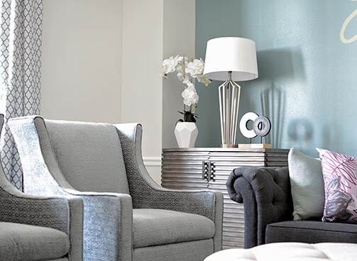 Detailed look at the waiting room's flower vase, metal cabinet, and lamp