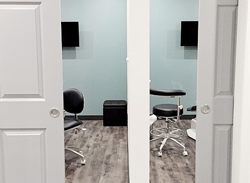 Two private treatment rooms showing TV's and comfortable chairs